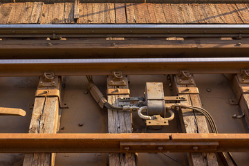 Close up of commuter railway tracks with power transformer