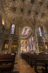 Fototapeta premium Few people at the main chapel of the Church of Santa Maria at Mosteiro dos Jeronimos (Jeronimos Monastery) in Belem, Lisbon, Portugal.