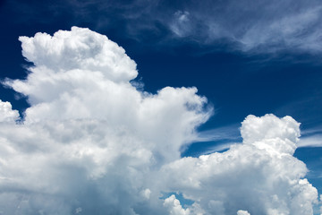 Large white clouds against the blue sky, a natural phenomenon of the overcast weather.