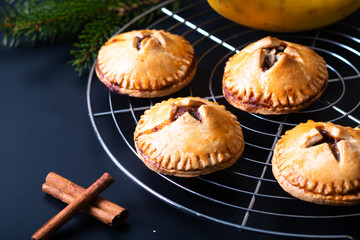 Food concept fresh baked Homemade Banana foster hand pie on black background