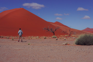 woman walking on dune in Namibia
