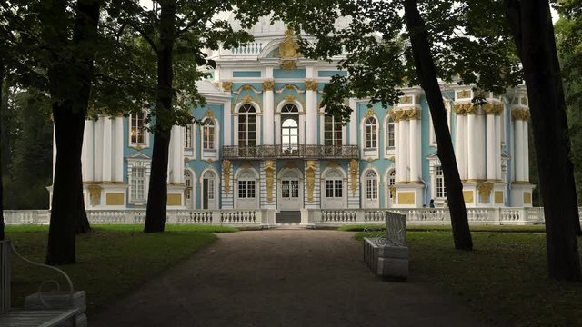 Handheld shot of path to Hermitage pavilion in Tsarskoe Selo during summer time. Alley to Hermitage, Catherine's Park in Tsarskoye Selo. A park pavilion built in the Baroque style