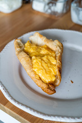 Breakfast of Croissant Stuffed with Scrambled Eggs.