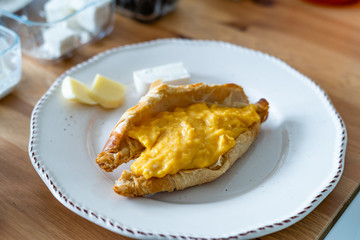 Breakfast of Croissant Stuffed with Scrambled Eggs.