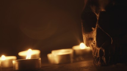 Candles and skull closeup photo