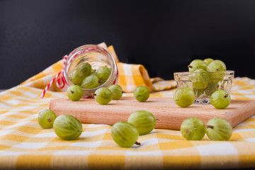 Scattered cherry-cherry-plums on the kitchen. Close-up. Glass cups with fruits.