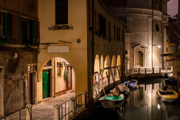 old town street and a picturesque water canal in venice