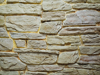 Sandstone wall texture background. Yellow old grunge surface, stone texture, voluminous background.