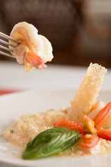 Risotto with shrimp on a fork