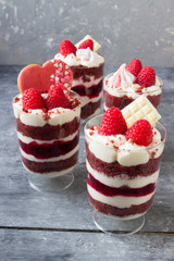 Dessert for lovers on Valentine's Day. Red biscuit with raspberry jelly, cream and fresh raspberries.