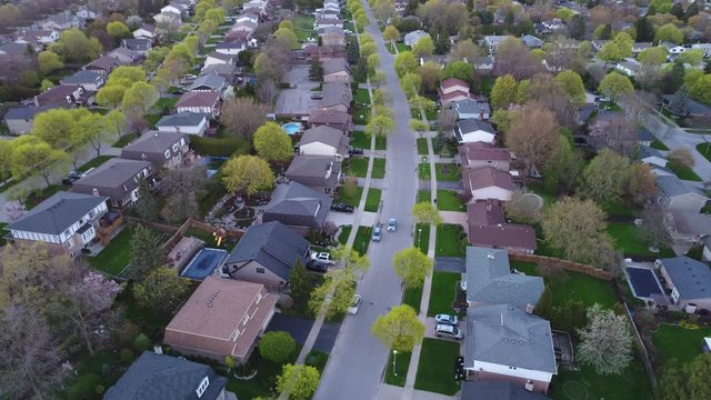 Descending Aerial Over Rows Of Middle Upper Class Homes Single Family Units Real Estate