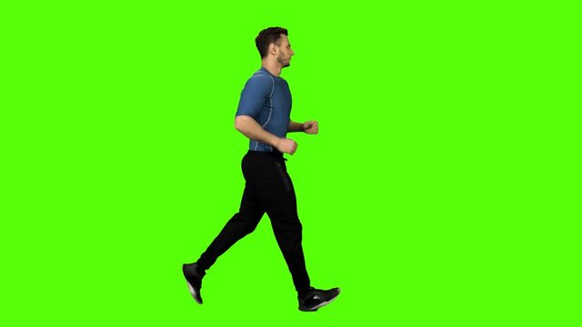 Muscular Man Running Over Green Screen.