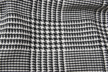 Black and white cage fabric or cloth textile.