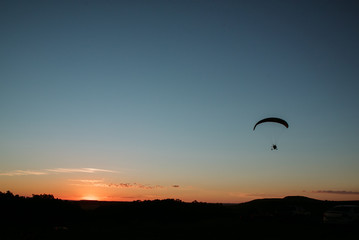 paragliding at sunset