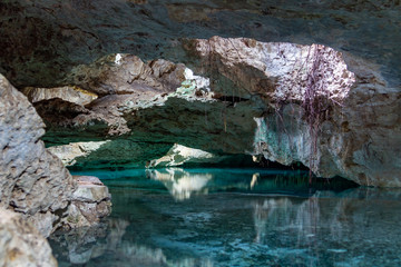 Mexican cenote, cavern with fresh water, water in a tropical jungle, luxury natural pool with torquiest water 