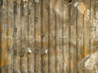 Texture of old cement surface with stripes left by fallen tiles. Yellow gray rough background. 