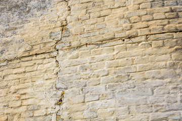 Old brick wall with big crack