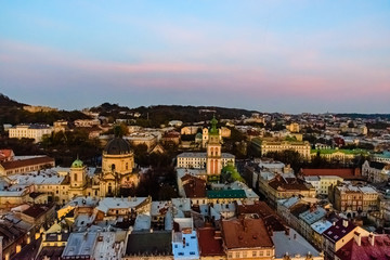 View on Dominican cathedral, Dormition church and historic center of the Lviv at sunset. View on Lvov cityscape from the town hall