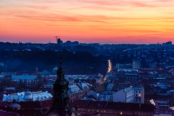 Fototapeta na wymiar View on a historic center of Lviv at sunset. View on Lvov cityscape from the town hall