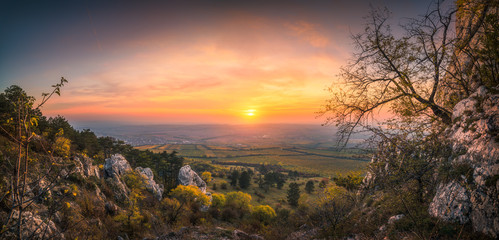 Colorful Autumn Sunset over Vineyards as Seen from Rocky Hill in Palava Protected Area near Mikulov...