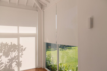 roller blinds, or rolon, decorating the interior of a residence.