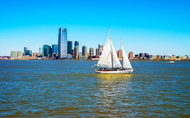 Jersey City, New Jersey and Hudson River. View from Manhattan, New York of USA. Skyline and cityscape with skyscrapers at United States of America, NYC, US. Road and American architecture.