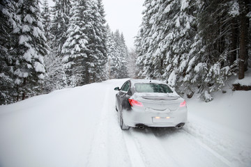 Driving a car on winter rural slippery roads.-Image - 313704927