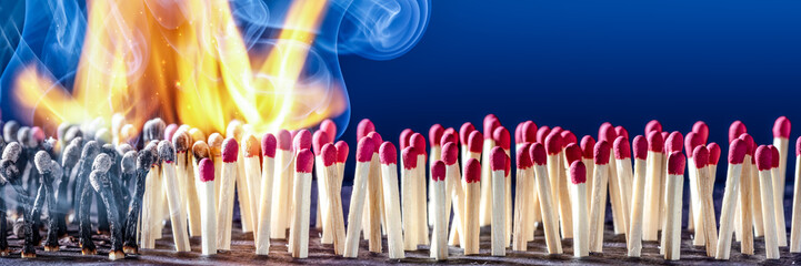 Group Of Matchsticks Bursting Into Flames In A Chain Reaction