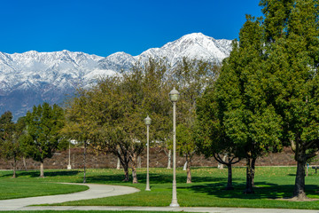 City park in Rancho Cucamonga with a view of  snow capped mountains.