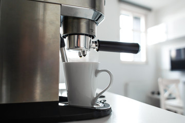 Close-up of making coffee in a coffee machine.
