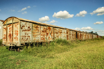 Fototapeta na wymiar abandoned train station and wagons railway