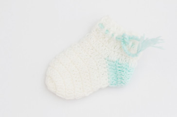 Handmade sweet baby booties isolated on white background