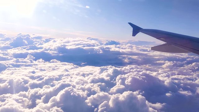 Huge Cloudscape on Airplane Above Storm through window