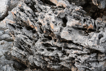 Close-up rock formation with cracks, backgrounds texture
