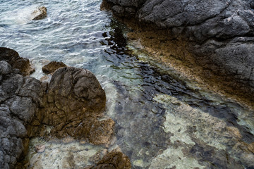 The sea is washed by a rocky coast