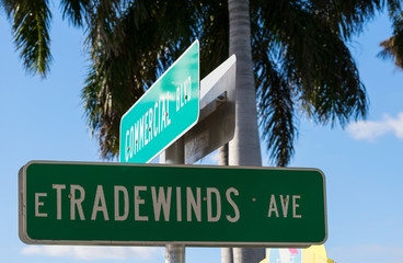 Fototapeta premium Street signs for Commercial Blvd and Tradewinds Avenue