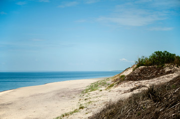 Sand dunes and sea on the Curonian Spit on a summer sunny day. Curonian Spit, Russia