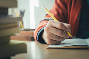 high school,university student study.hands holding pencil writing paper answer sheet.sitting...