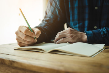 high school,university student study.hands holding pencil writing paper answer sheet.sitting lecture chair taking final exam attending in examination classroom.concept scholarship for education abroad