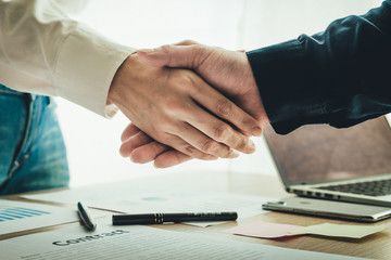 handshake business partners agree to contract Real Estate Venture International trade,contract investment in meetings vision to invest for profit.