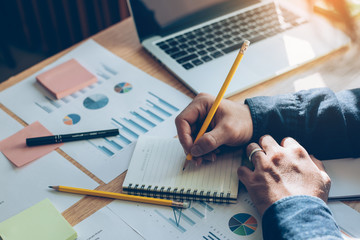 contact marketing businessman professional people thinking while working writing information documents in home offices at desk with computer,laptop,cell phone,business report chart