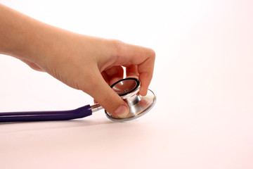 medical stethoscope at hand, healthcare concept by regular health check.