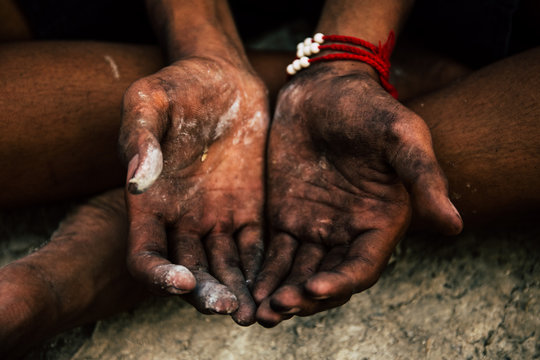 old man beggar begging you for help sitting at dirty slum. concept for poverty or hunger people,human rights,donate and charity for underprivileged children in third world 