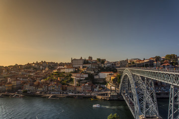 Porto, Portugal - Old town wine port skyline with douro river and Dom Luis iron bridge at sunset