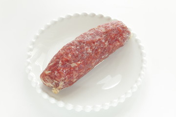 Italian food, salami on dish with copy space