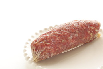 Italian food, salami on dish with copy space