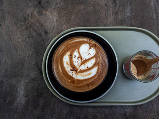 Mocha coffee on wooden table background.