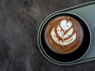 Mocha coffee on wooden table background.