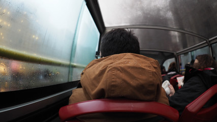 Jacket with water droplets on a public bus
