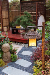 Fototapeta na wymiar Lantern in beautiful oriental Japanese backyard garden
